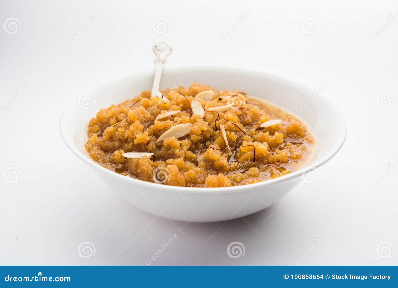 moong dal halwa or mung daal halva is an indian sweet /ÃÂ dessert recipe, garnished with dry fruits